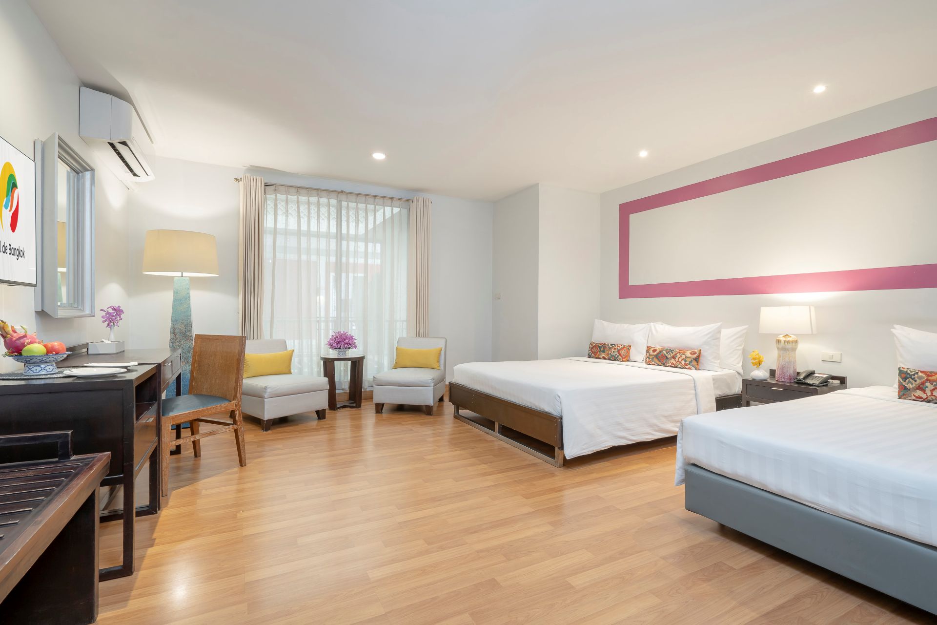 The Deluxe Room at Hotel de Bangkok emphasizes bright, clean aesthetics and modern design, providing a welcoming, home-like feel in the city.